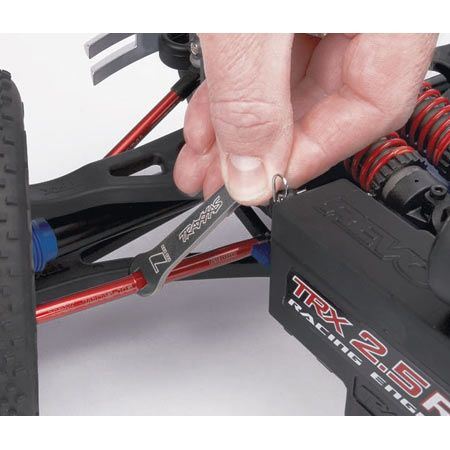 TRAXXAS Toe links, Revo (red-anodised) (128mm, fits Fr or Rr) (2)